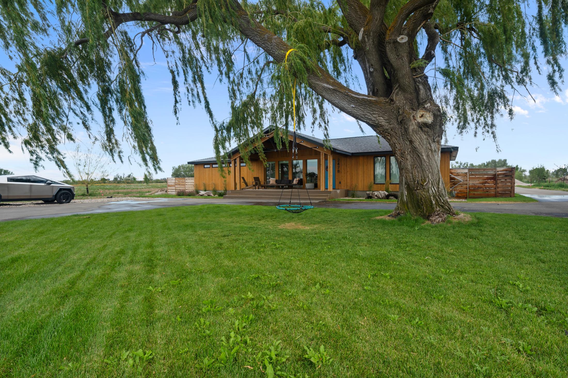 Southeast Idaho home under a willow tree