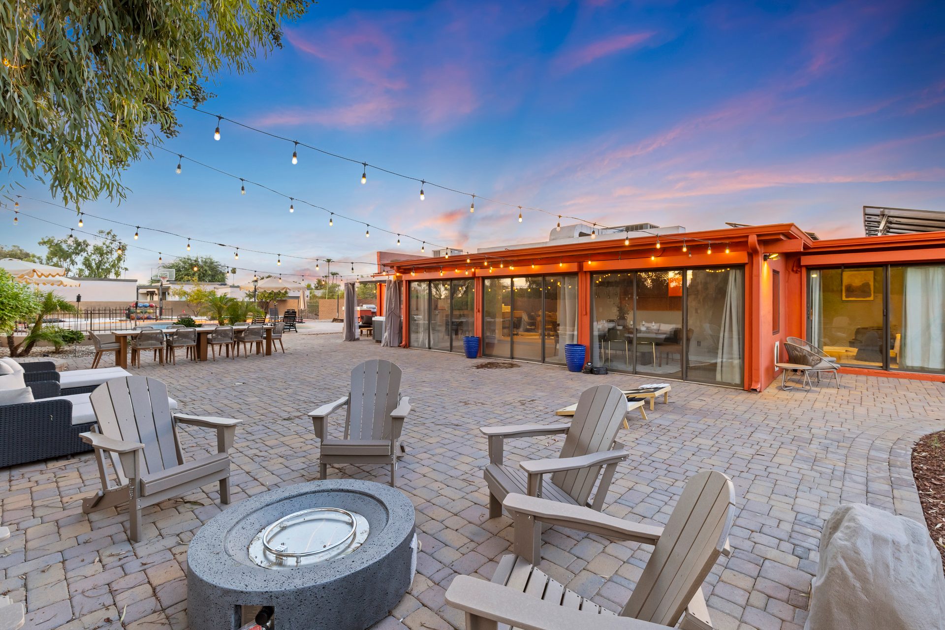 Fire pit and Adirondack chairs at sunset on a Scottsdale estate patio