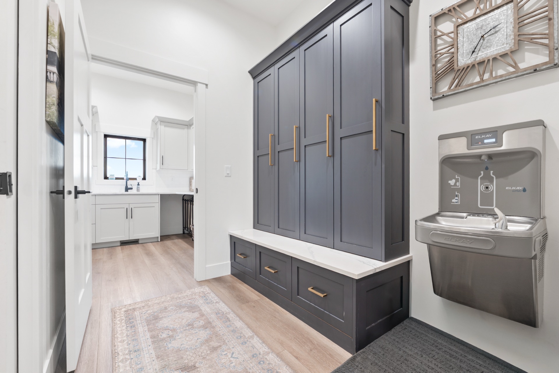 Mudroom with built-in storage and filtered water dispenser