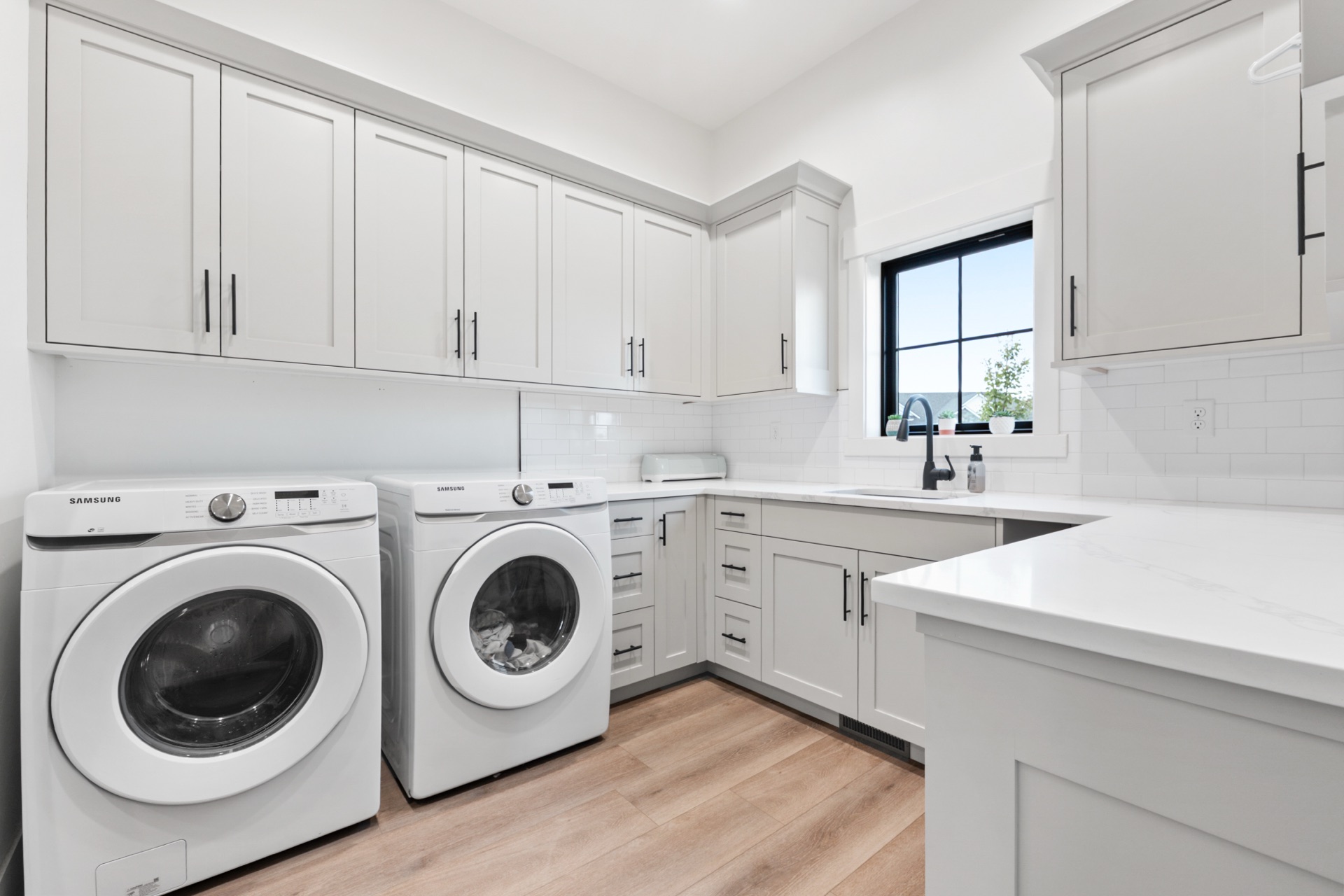 Modern laundry room with side-by-side washer dryer