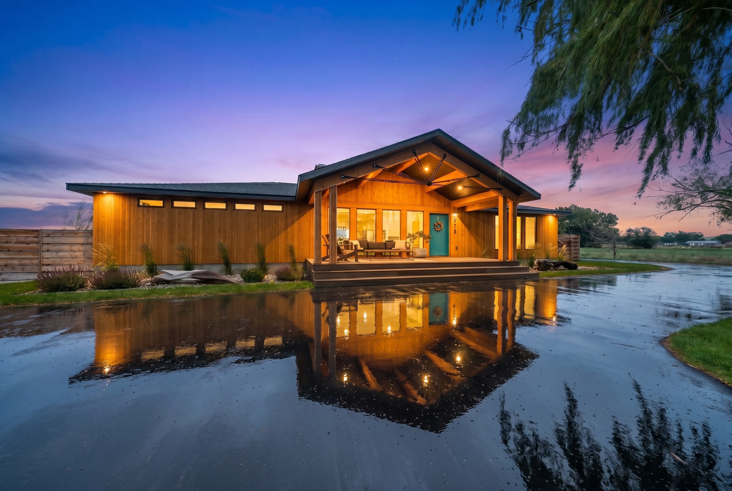Southeast Idaho home at twilight with every interior light on, photographed for a vacation rental listing